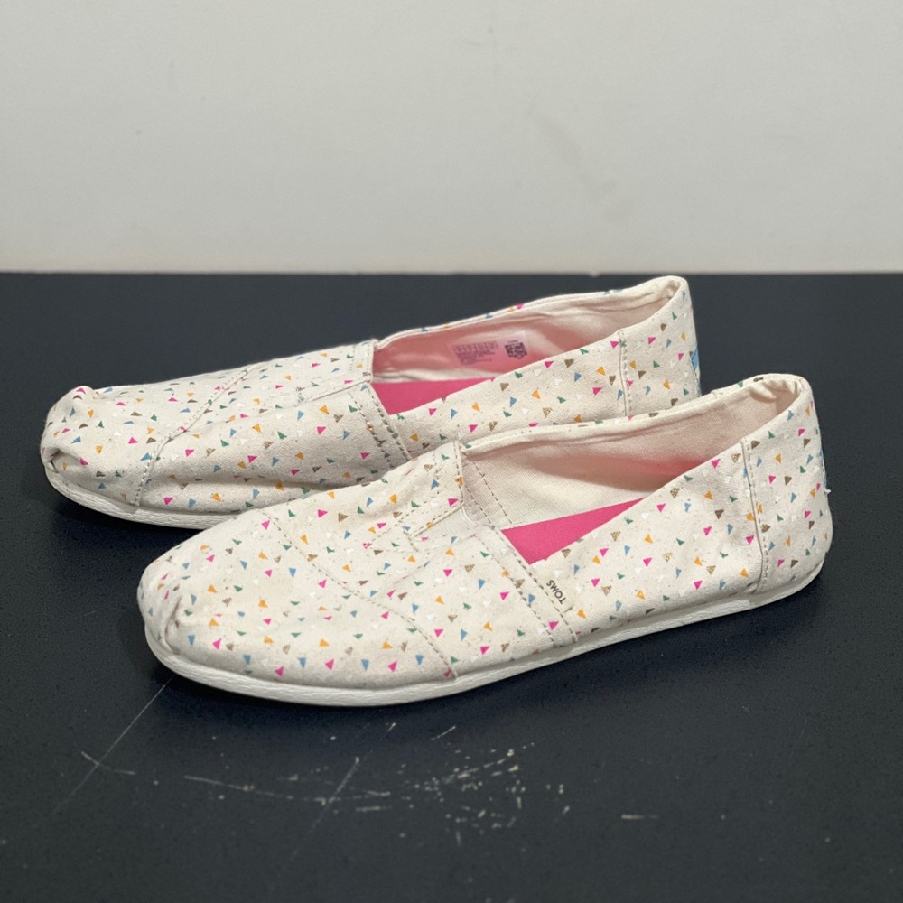 Toms Cream Canvas Slip-Ons with Pink Lining and Multicolor Triangle Print